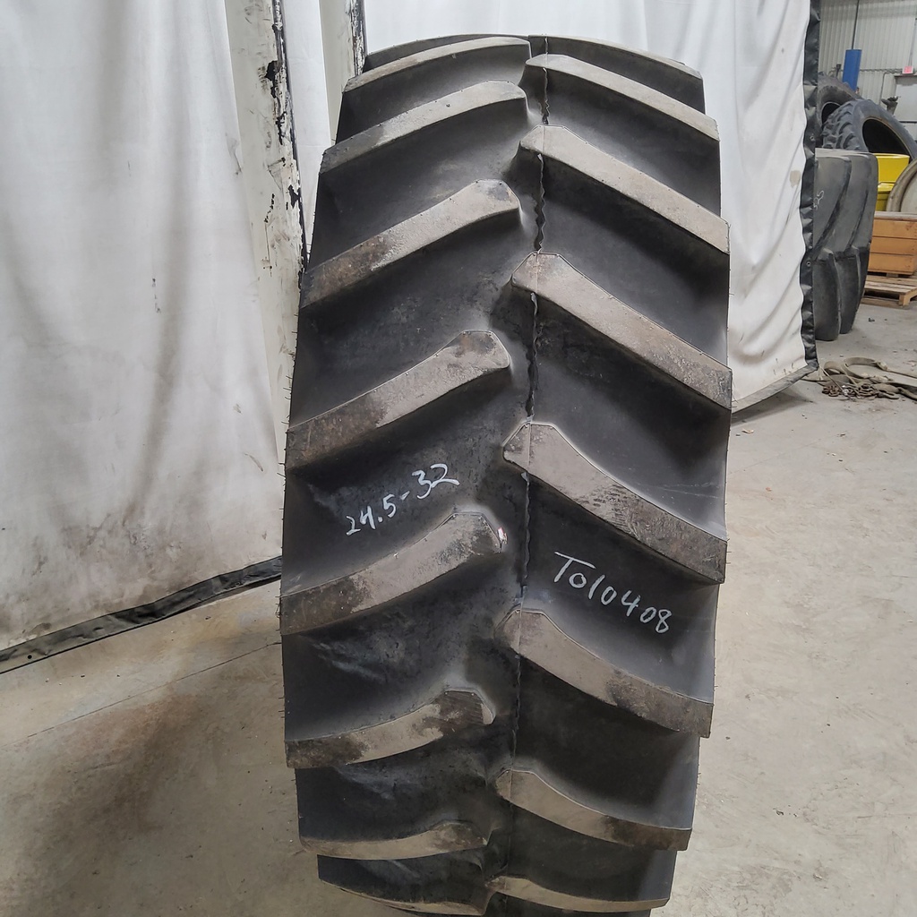 24.5/-32 Firestone Super All Traction 23 R-1, F (12 Ply) 95%