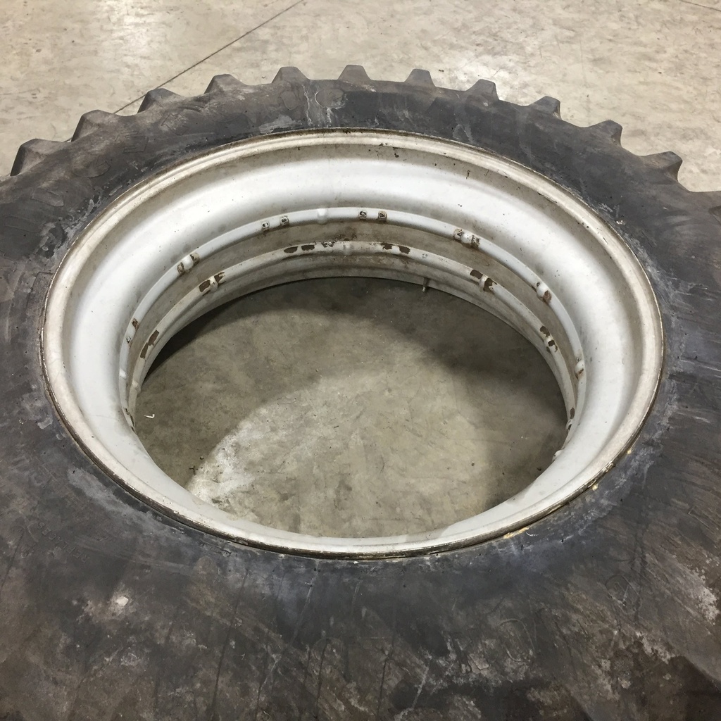 18.4/R42 Firestone Radial All Traction 23 R-1 on John Deere Yellow 0-Hole Double Bevel 38" Cast 65%
