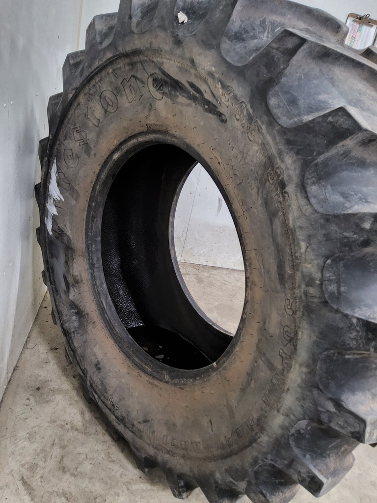 24.5/-32 Firestone Super All Traction 23 R-1 , F (12 Ply) 85%