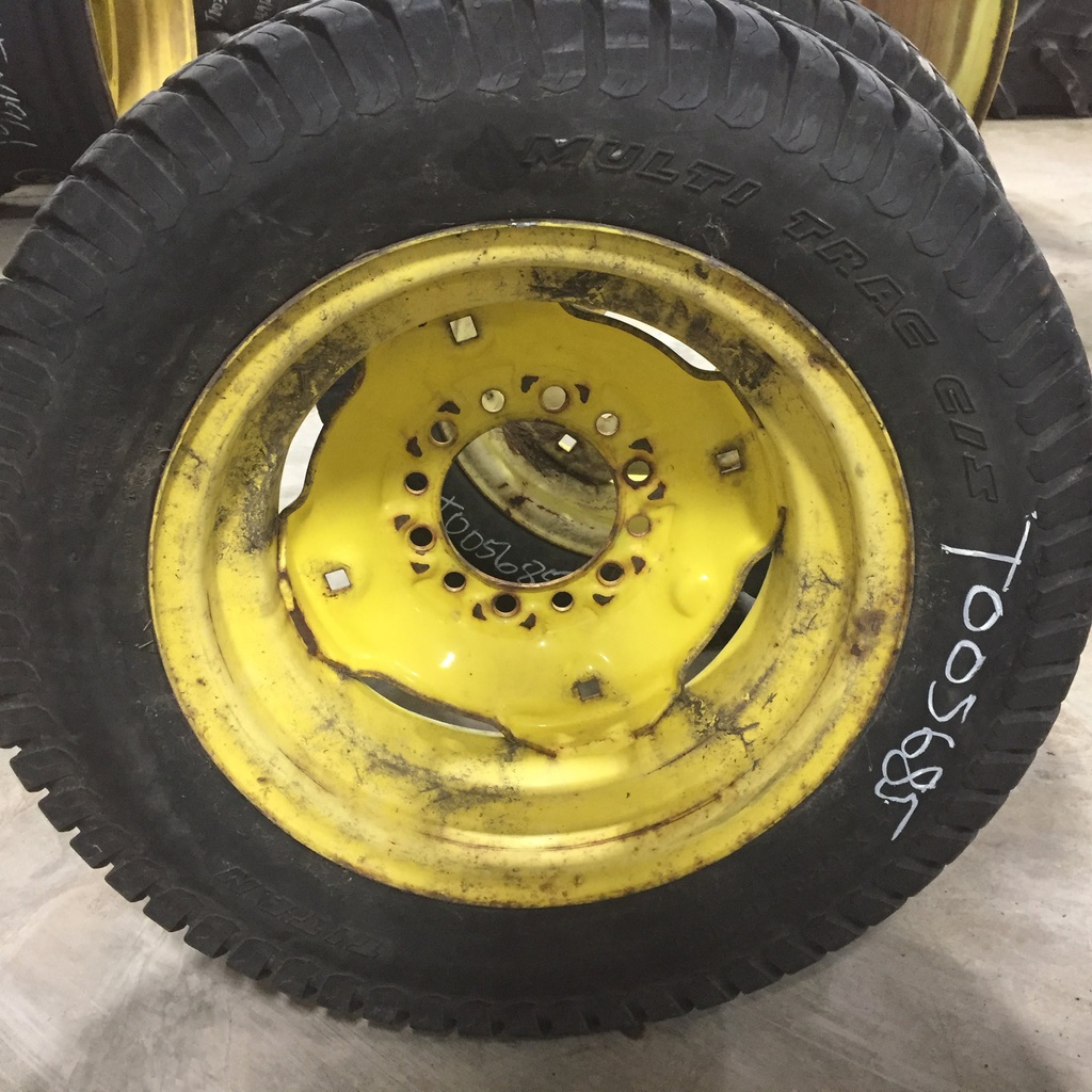 27/8.50-15 Titan Farm Multi Trac C/S NHS  HF-1 on John Deere Yellow 6-Hole Implement 70%
