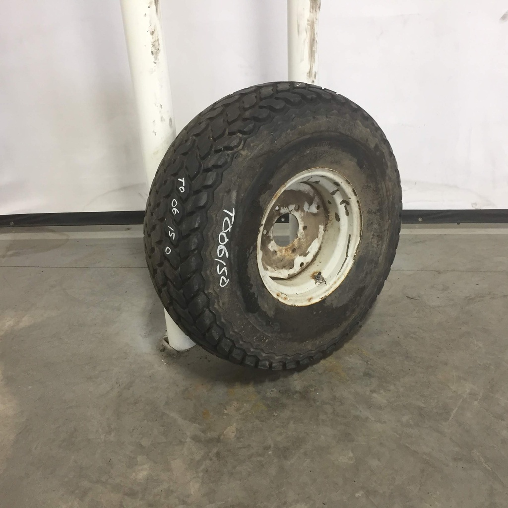 13.6/-16 Firestone Turf & Field 5-Rib R-3 on New Holland White 6-Hole Implement 90%