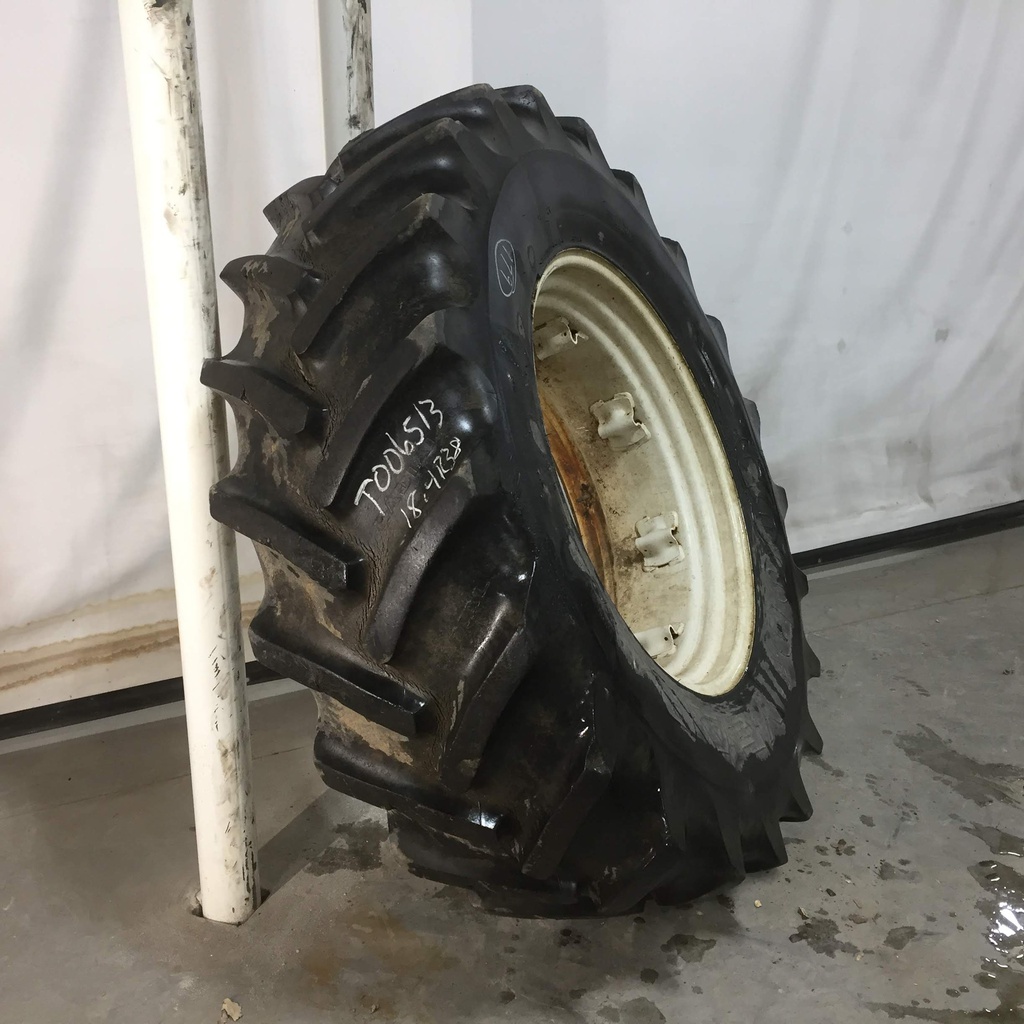 18.4/R34 Goodyear Farm Super Traction Radial R-1W on New Holland White 8-Hole Rim with Clamp/Loop Style 60%