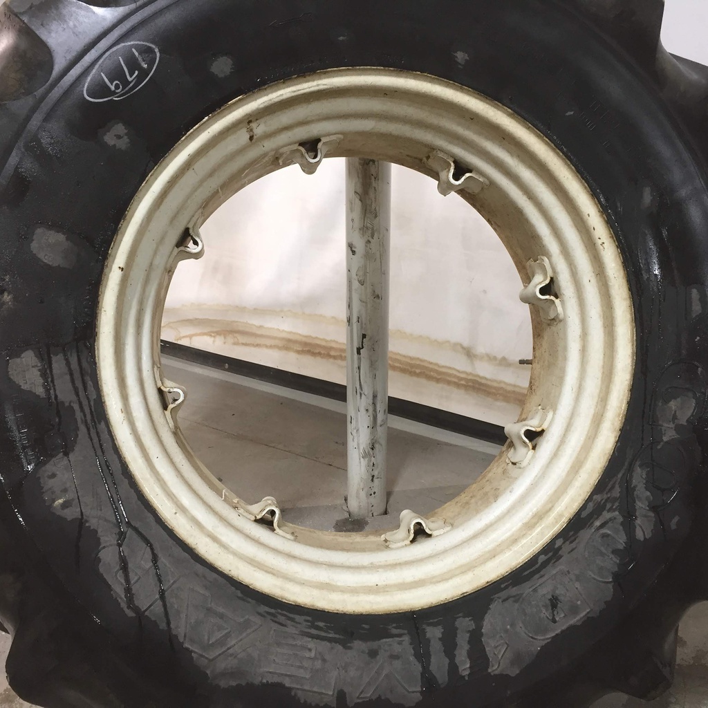 18.4/R34 Goodyear Farm Super Traction Radial R-1W on New Holland White 8-Hole Rim with Clamp/Loop Style 60%