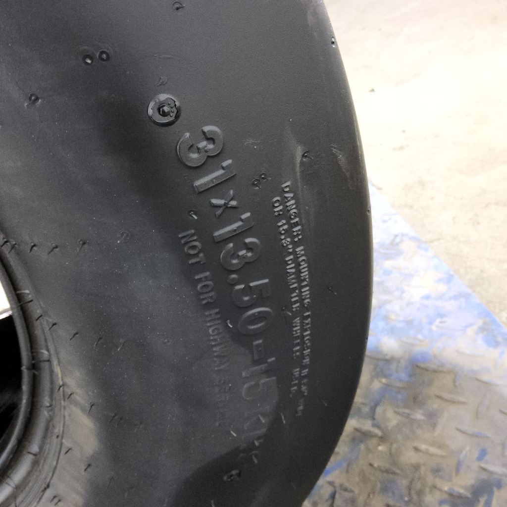 31x13.50-15 Titan Farm Flo-Trac Rib HF-1 C (6 Ply), 99%