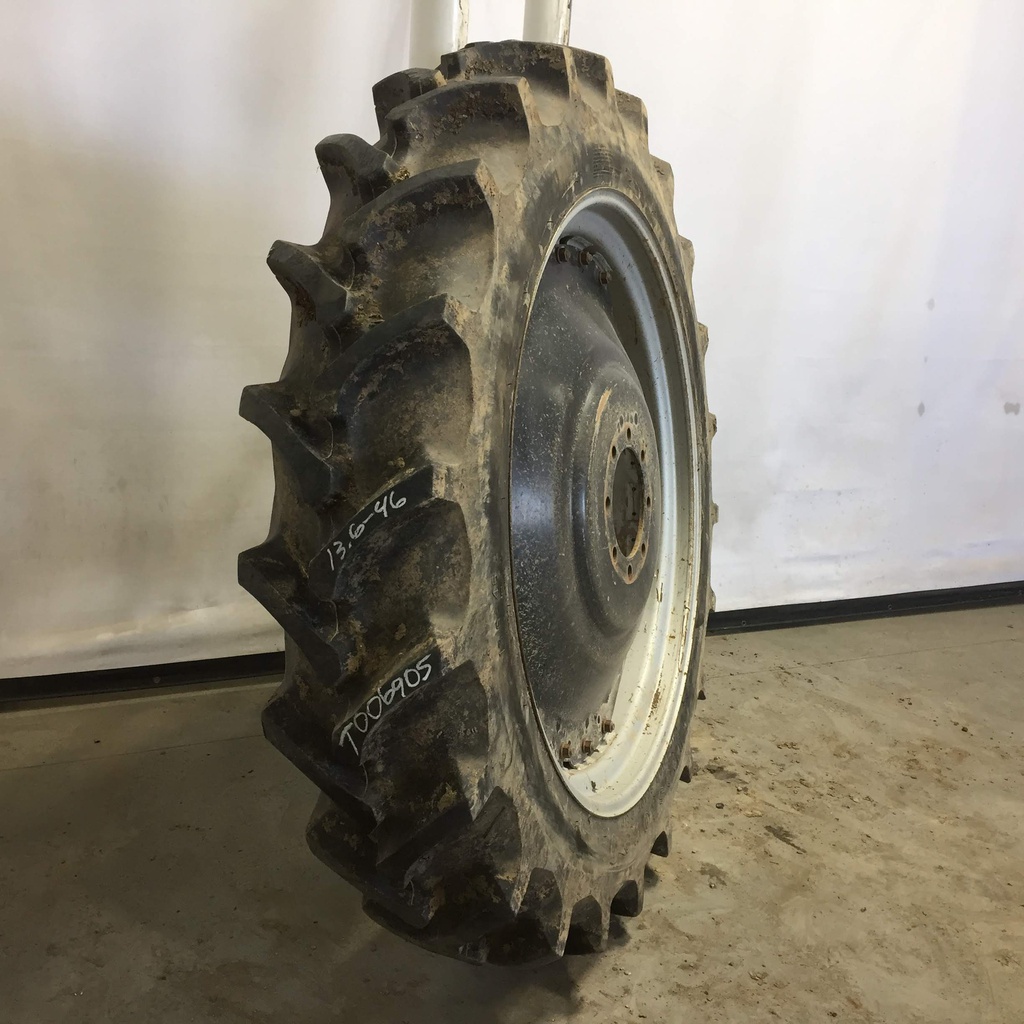 13.6/-46 Firestone Champion Spade Grip R-2 on Case IH Silver Mist/Black 8-Hole Rim with Clamp/U-Clamp (groups of 3 bolts) 85%