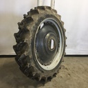 13.6/-46 Firestone Champion Spade Grip R-2 on Case IH Silver Mist/Black 8-Hole Rim with Clamp/U-Clamp (groups of 3 bolts) 85%