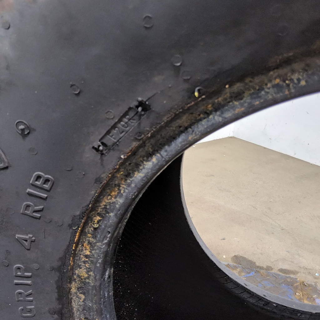 14L-16.1 Firestone Champion Guide Grip 4-Rib F-2M E (10 Ply), 85%