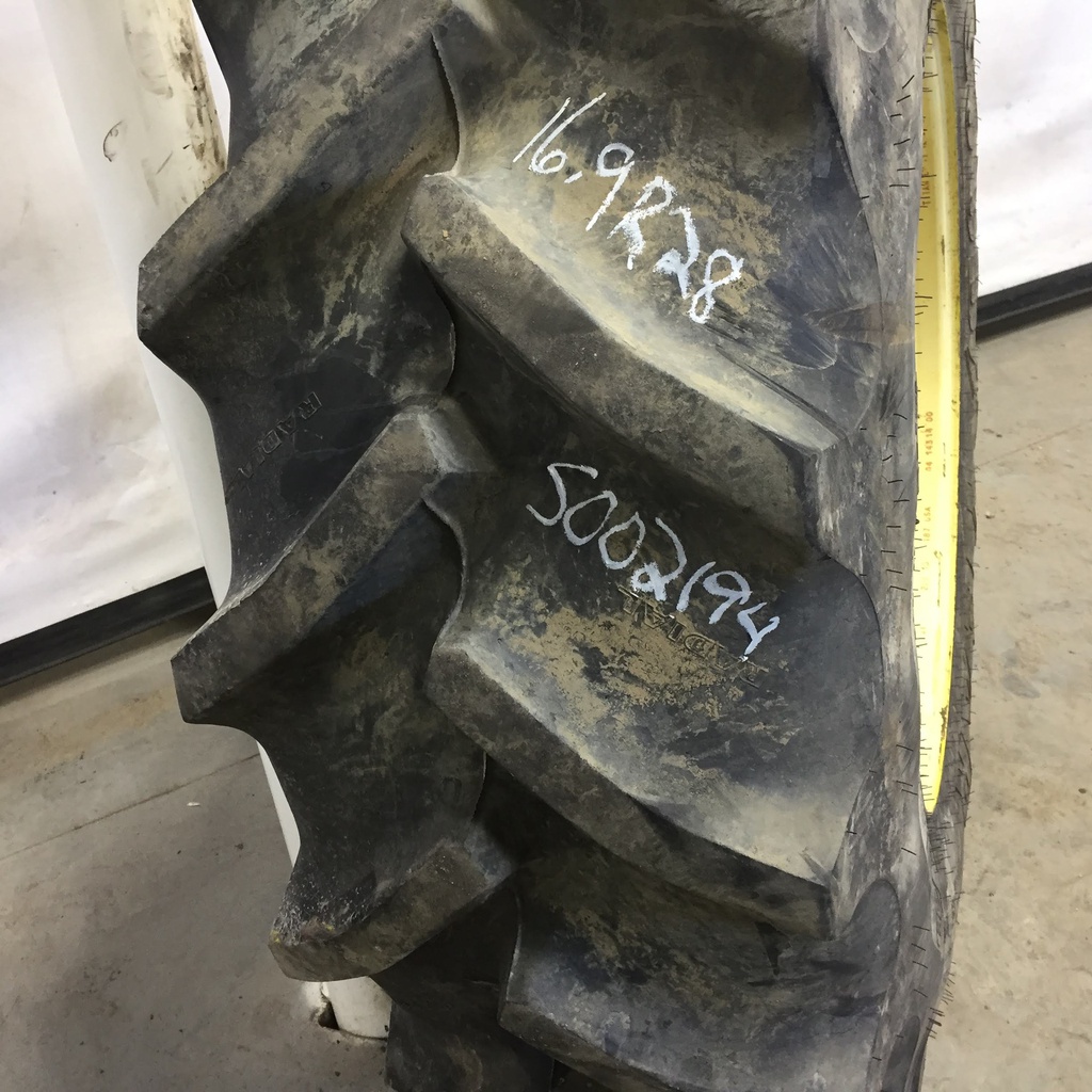 16.9/R28 Goodyear Farm Super Traction Radial R-1W on John Deere Yellow 12-Hole Waffle Wheel (Groups of 3 bolts) 85%