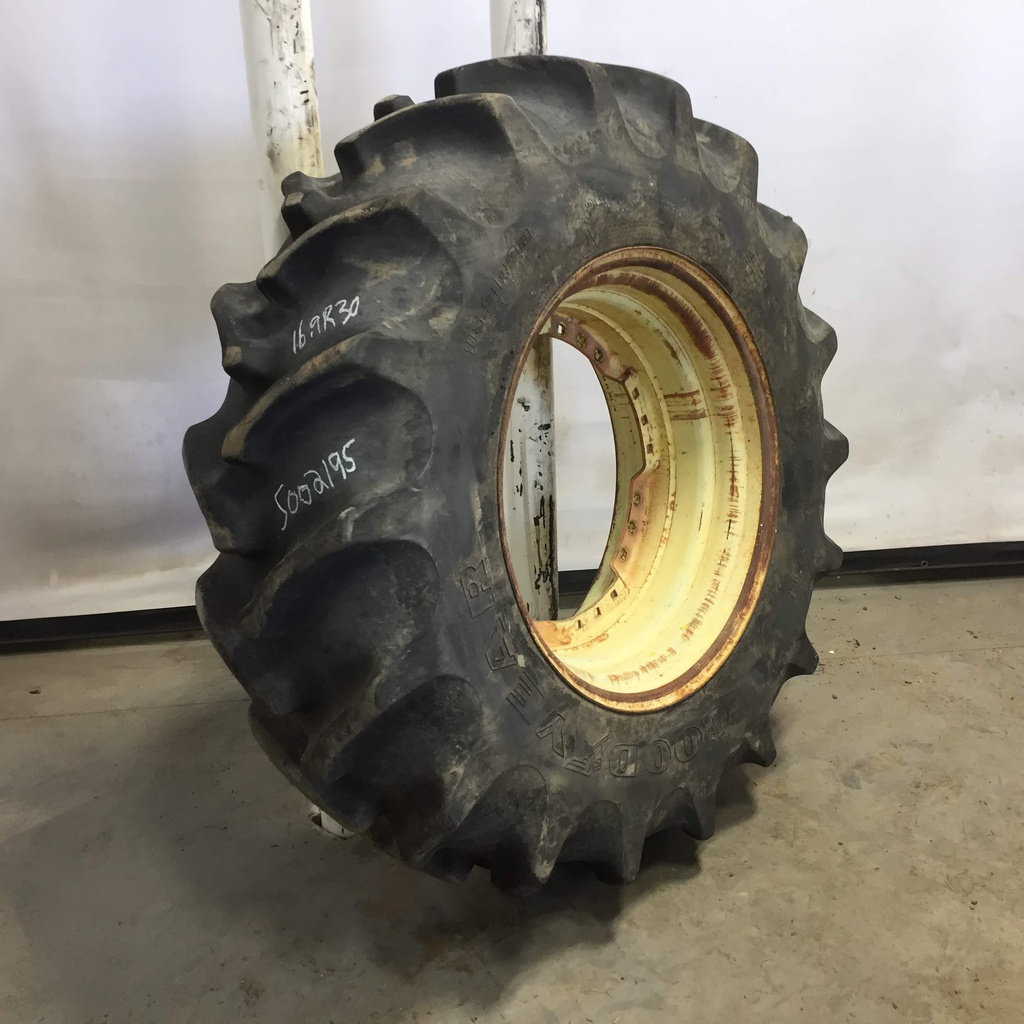 16.9/R30 Goodyear Farm Special Sure Grip Radial TD8 R-2 on John Deere Yellow 12-Hole Waffle Wheel (Groups of 3 bolts) 80%