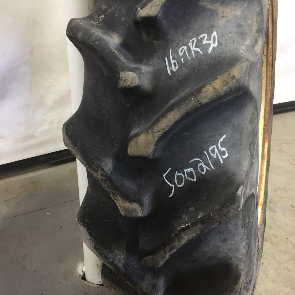 16.9/R30 Goodyear Farm Special Sure Grip Radial TD8 R-2 on John Deere Yellow 12-Hole Waffle Wheel (Groups of 3 bolts) 80%