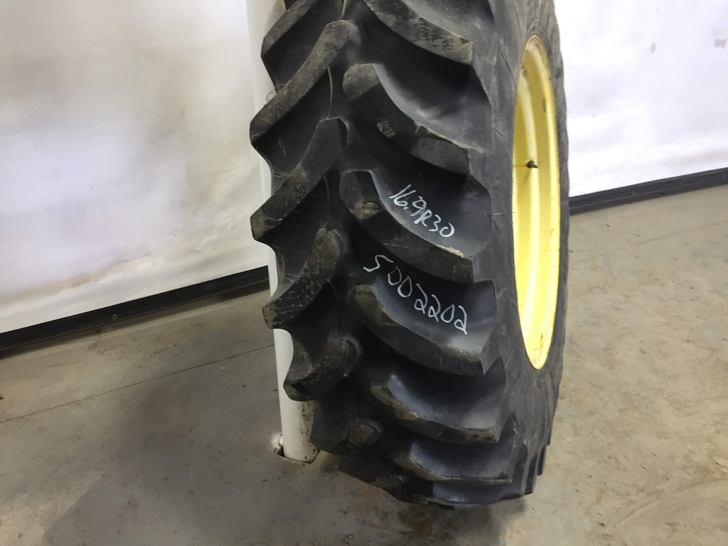 420/90R30 Firestone Radial All Traction FWD R-1 on John Deere Yellow 12-Hole Waffle Wheel (Groups of 3 bolts) 60%