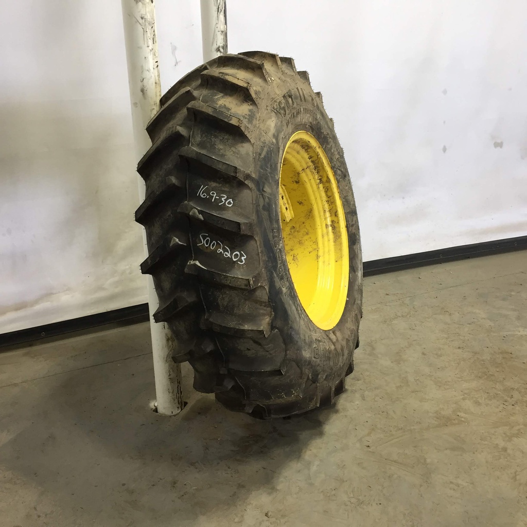 16.9/-30 Firestone Super All Traction II 23 R-1 on John Deere Yellow 8-Hole Rim with Clamp/U-Clamp (groups of 2 bolts) 95%