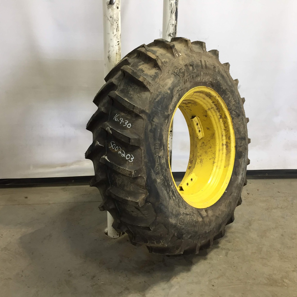 16.9/-30 Firestone Super All Traction II 23 R-1 on John Deere Yellow 8-Hole Rim with Clamp/U-Clamp (groups of 2 bolts) 95%