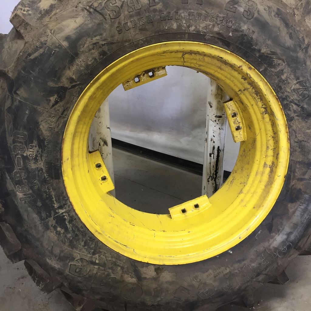 16.9/-30 Firestone Super All Traction II 23 R-1 on John Deere Yellow 8-Hole Rim with Clamp/U-Clamp (groups of 2 bolts) 95%