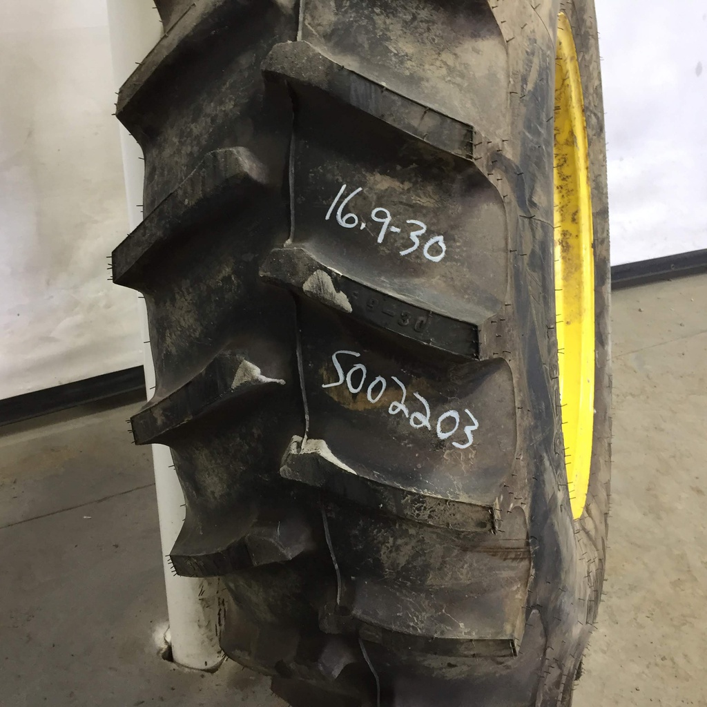 16.9/-30 Firestone Super All Traction II 23 R-1 on John Deere Yellow 8-Hole Rim with Clamp/U-Clamp (groups of 2 bolts) 95%