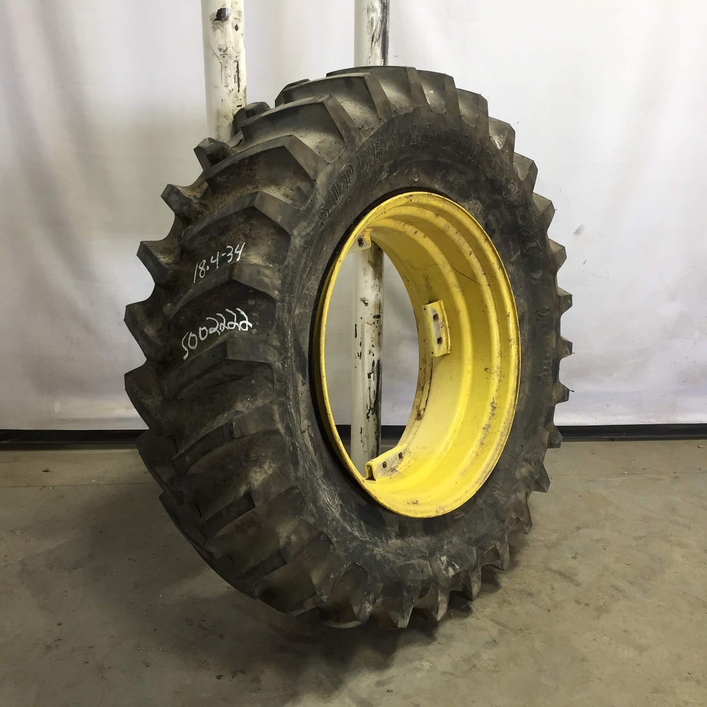 18.4/-34 Firestone Super All Traction 23 R-1 on John Deere Yellow 8-Hole Rim with Clamp/U-Clamp (groups of 2 bolts) 99%