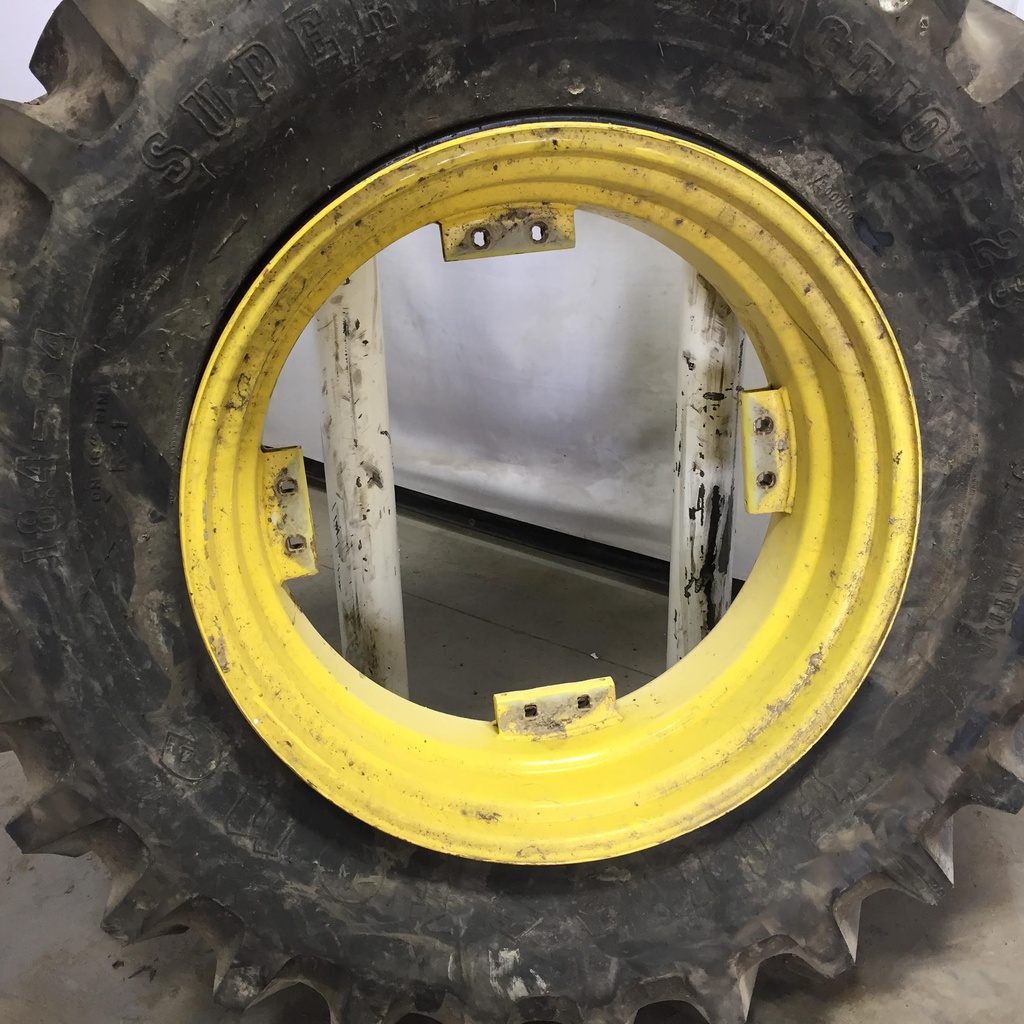 18.4/-34 Firestone Super All Traction 23 R-1 on John Deere Yellow 8-Hole Rim with Clamp/U-Clamp (groups of 2 bolts) 99%