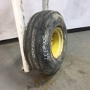 11.00/-16 Firestone Champion Guide Grip 4-Rib F-2M on John Deere Yellow 8-Hole Implement 35%