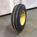 7.50/-16 Firestone Champion Guide Grip 3-Rib F-2 on John Deere Yellow 6-Hole Implement 65%