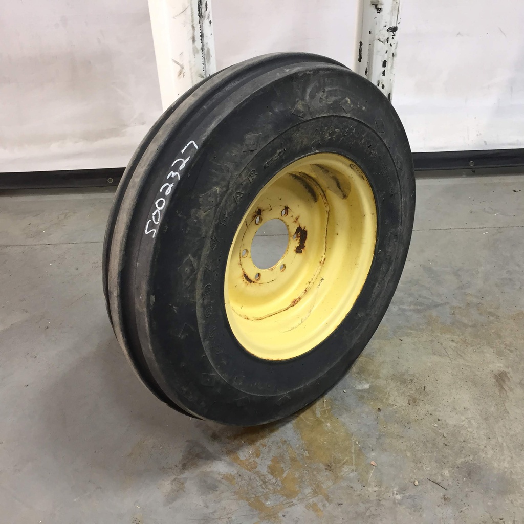 7.50/-16 Firestone Champion Guide Grip 3-Rib F-2 on John Deere Yellow 6-Hole Implement 65%