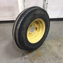 7.50/-16 Firestone Champion Guide Grip 3-Rib F-2 on John Deere Yellow 6-Hole Implement 65%