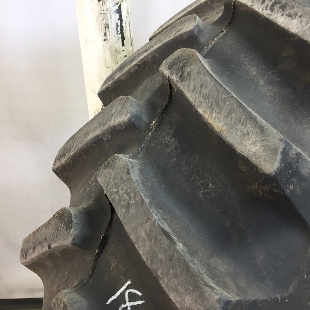 18.4/-34 Firestone Super All Traction 23 R-1 on John Deere Yellow 8-Hole Rim with Clamp/U-Clamp (groups of 2 bolts) 95%
