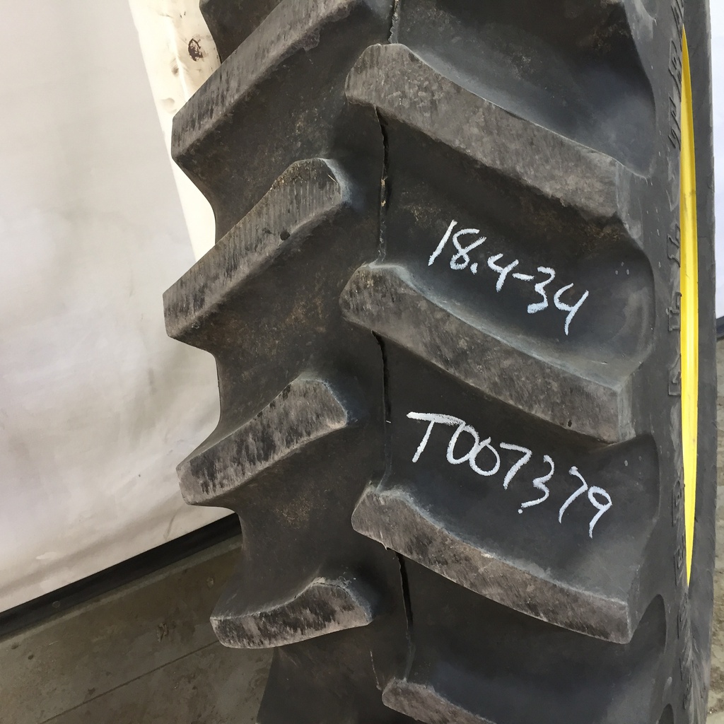 18.4/-34 Firestone Super All Traction 23 R-1 on John Deere Yellow 8-Hole Rim with Clamp/U-Clamp (groups of 2 bolts) 95%