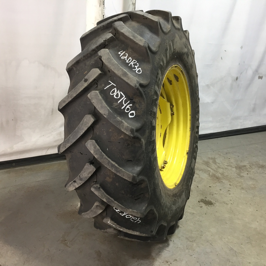 420/85R30 Continental AC85 Contract R-1W on John Deere Yellow 8-Hole Stub Disc (groups of 2 bolts) 75%