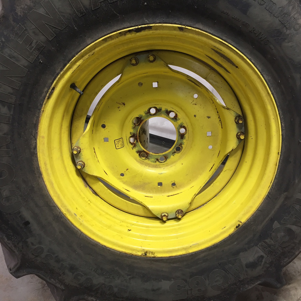 420/85R30 Continental AC85 Contract R-1W on John Deere Yellow 8-Hole Stub Disc (groups of 2 bolts) 75%