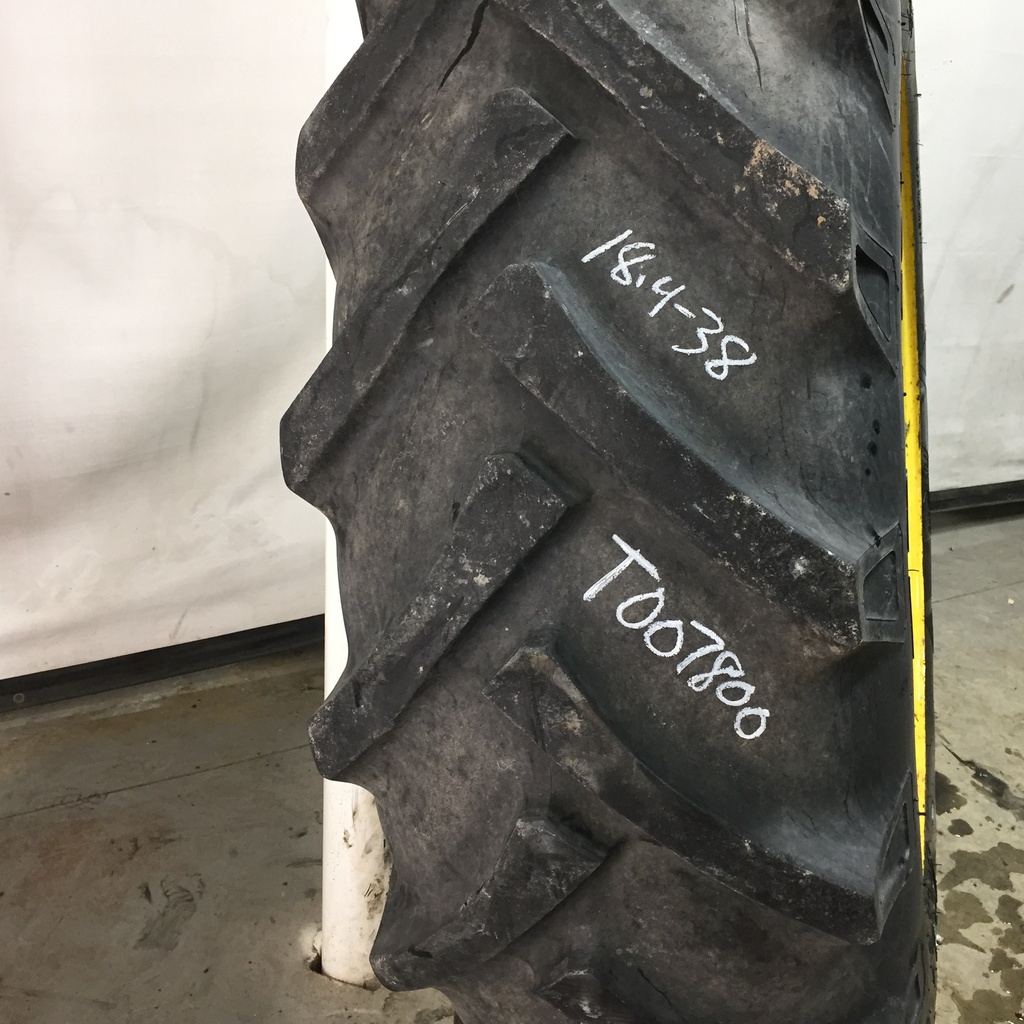 18.4/-38 BKT Tires TR 135 Drive R-1 on John Deere Yellow 12-Hole Stub Disc 60%