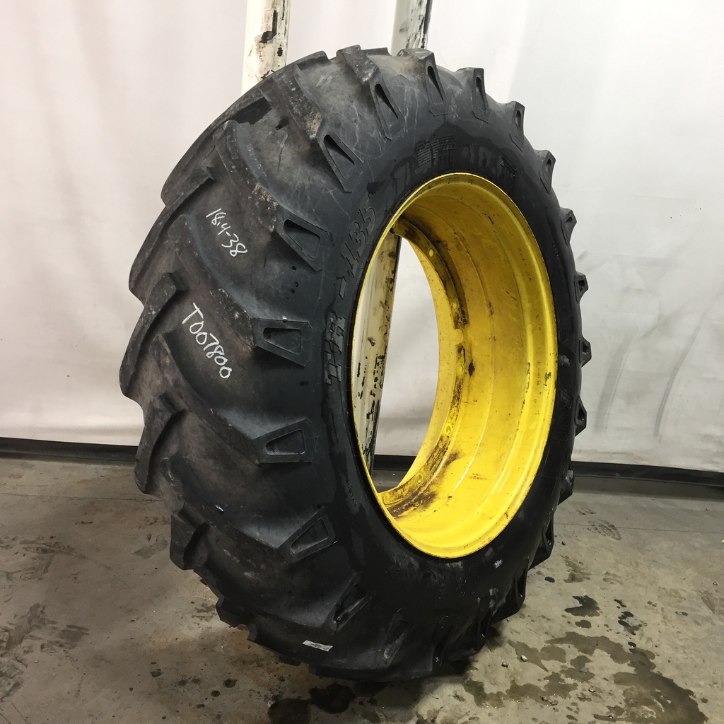 18.4/-38 BKT Tires TR 135 Drive R-1 on John Deere Yellow 12-Hole Stub Disc 60%