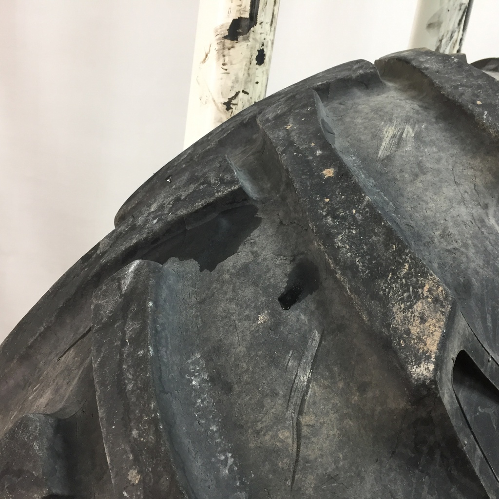 18.4/-38 BKT Tires TR 135 Drive R-1 on John Deere Yellow 12-Hole Stub Disc 60%