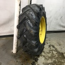16.9/-26 BKT Tires TR 135 Drive R-1 on John Deere Yellow 10-Hole Waffle Wheel (Groups of 2 bolts) 30%