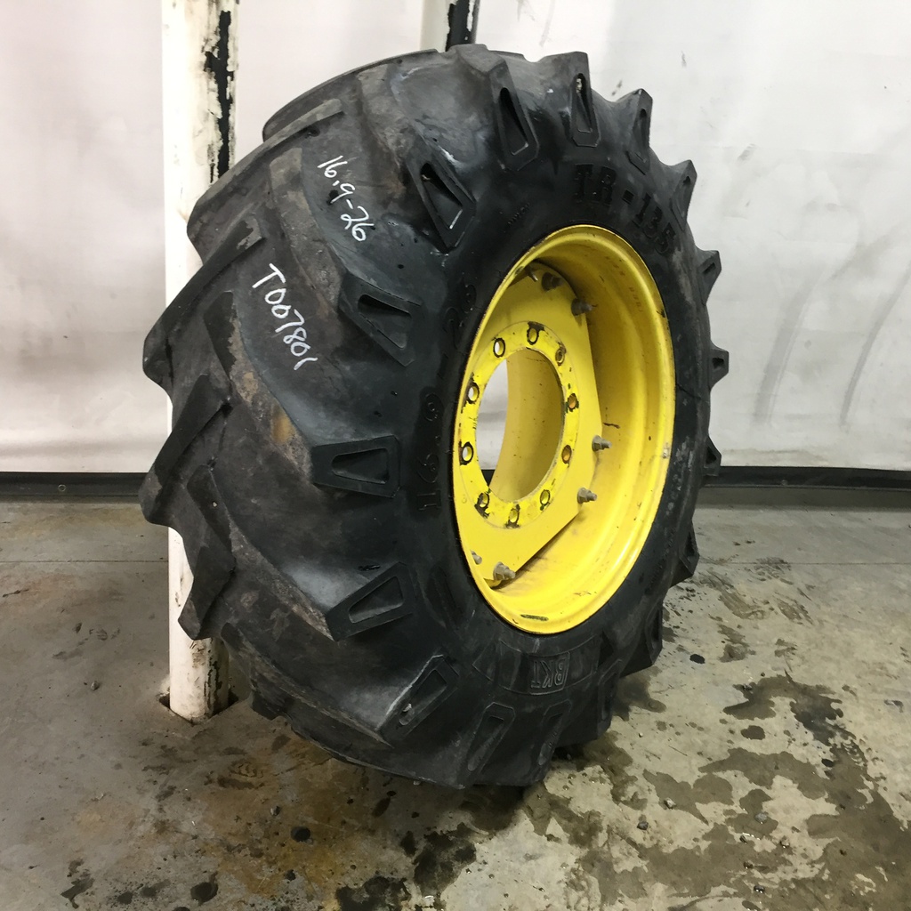 16.9/-26 BKT Tires TR 135 Drive R-1 on John Deere Yellow 10-Hole Waffle Wheel (Groups of 2 bolts) 30%