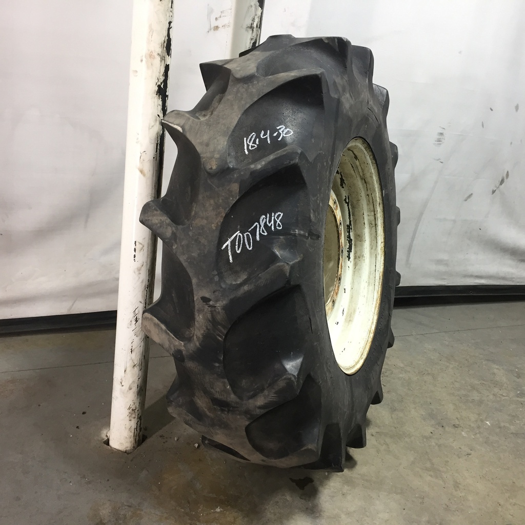 18.4/-30 Firestone Champion Spade Grip R-2 on New Holland White 12-Hole Waffle Wheel (Groups of 2 bolts) 25%