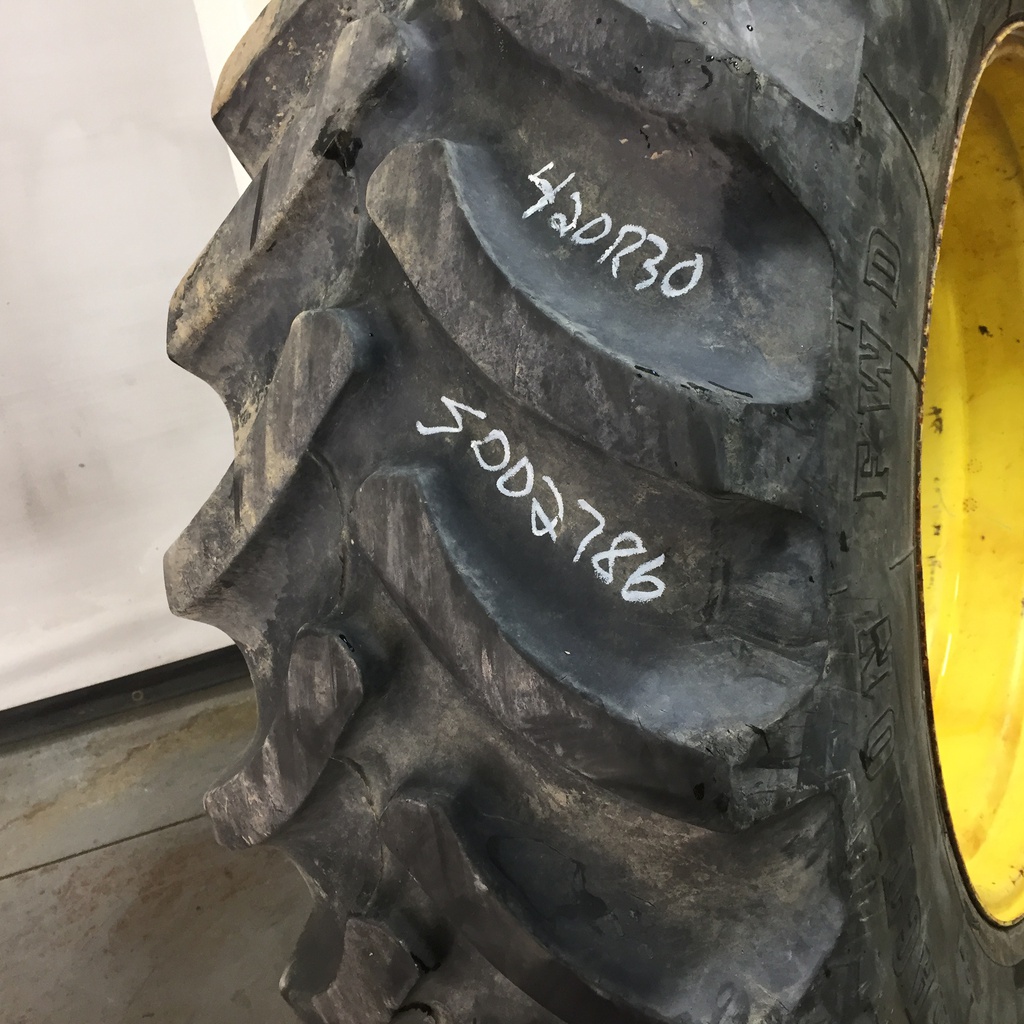 420/90R30 Firestone Radial All Traction FWD R-1 on John Deere Yellow 8-Hole Rim with Clamp/U-Clamp (groups of 2 bolts) 75%