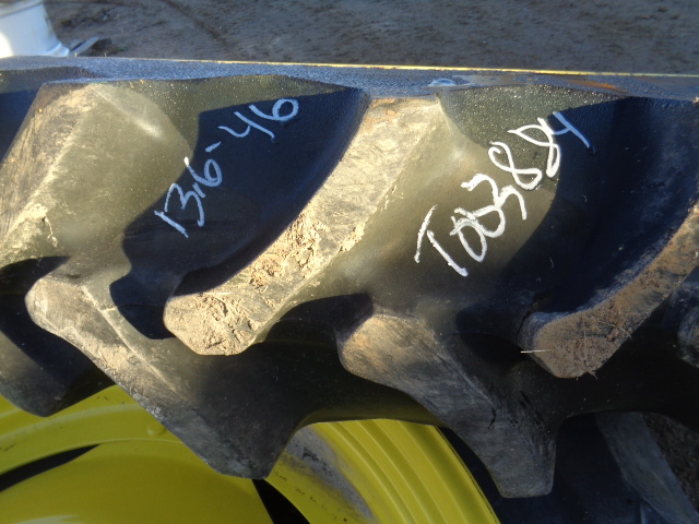 13.6/-46 Firestone Champion Spade Grip R-2 on John Deere Yellow 8-Hole Stub Disc 70%