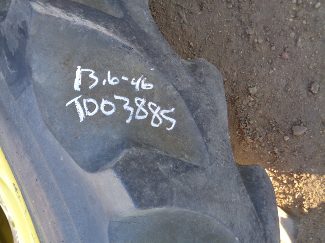 13.6/-46 Firestone Champion Spade Grip R-2 on John Deere Yellow 8-Hole Stub Disc 55%
