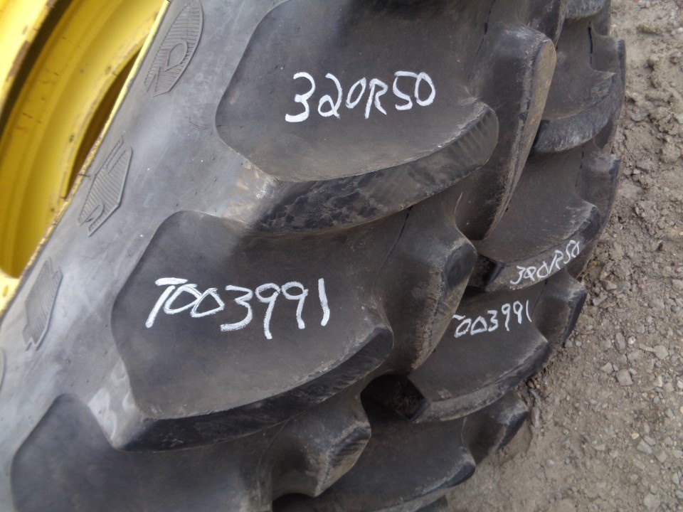 320/90R50 Firestone Radial 9000 R-1W on John Deere Yellow 12-Hole Stub Disc 75%