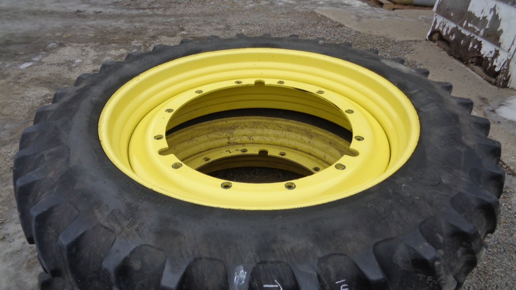 14.9/R46 Firestone Radial All Traction 23 R-1 on John Deere Yellow 12-Hole Stub Disc 60%