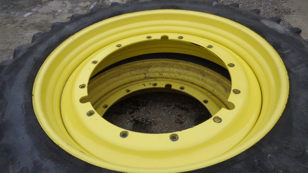 14.9/R46 Firestone Radial All Traction 23 R-1 on John Deere Yellow 12-Hole Stub Disc 60%