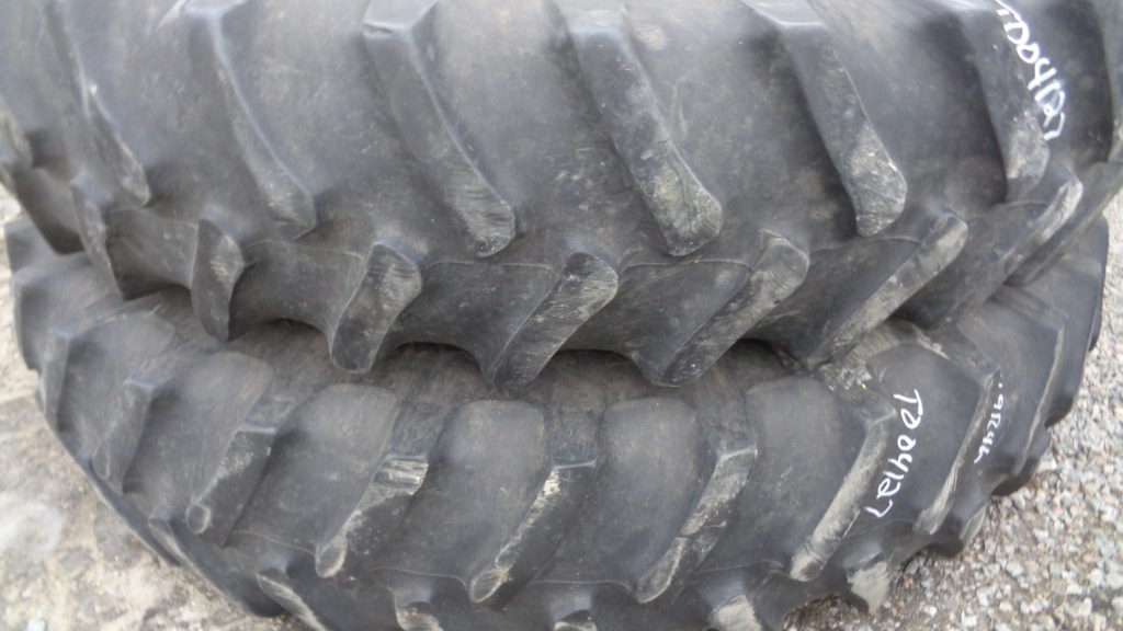 14.9/R46 Firestone Radial All Traction 23 R-1 on John Deere Yellow 12-Hole Stub Disc 60%