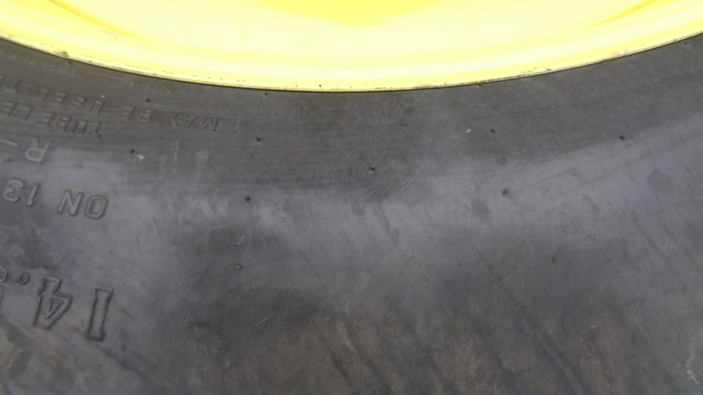 14.9/R46 Firestone Radial All Traction 23 R-1 on John Deere Yellow 12-Hole Stub Disc 60%