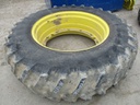 18.4/R38 Firestone Radial All Traction 23 R-1 on John Deere Yellow 12-Hole Stub Disc 65%