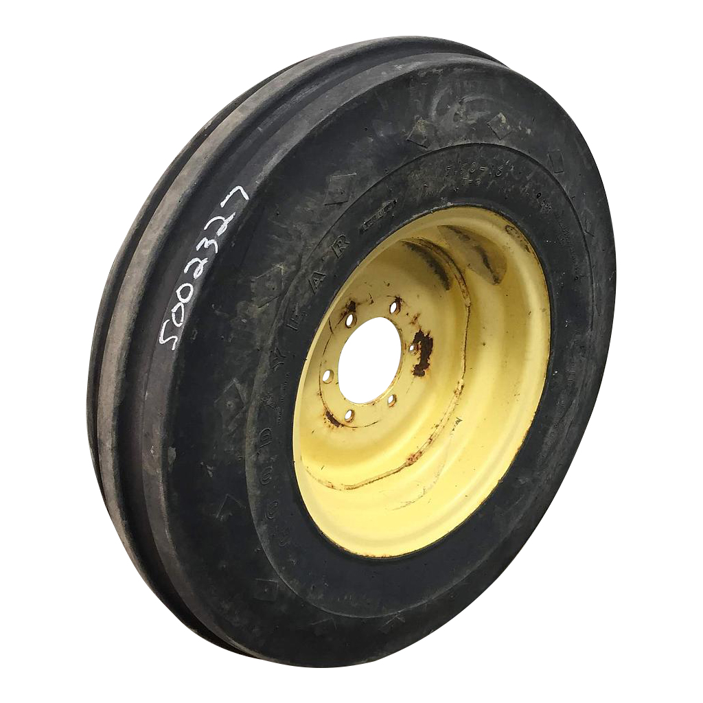 7.50/-16 Firestone Champion Guide Grip 3-Rib F-2 on John Deere Yellow 6-Hole Implement 65%