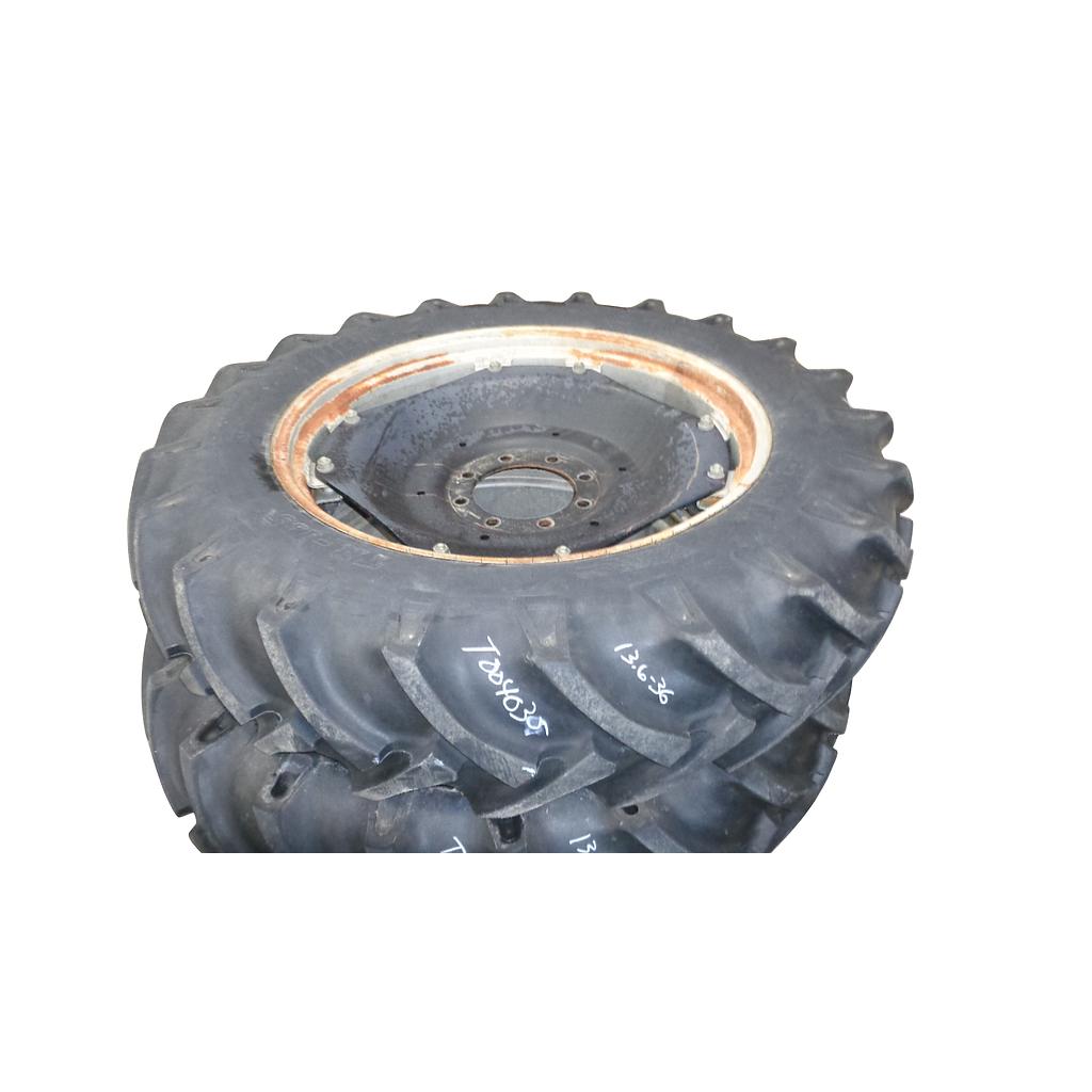 13.6/-36 BKT Tires TR 135 Drive R-1 on Case IH Silver Mist/Black 8-Hole Rim with Clamp/U-Clamp (groups of 2 bolts) 99%