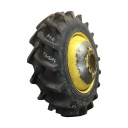 18.4/-38 Firestone Champion Spade Grip R-2 on John Deere Yellow 10-Hole Dolly Dual 80%
