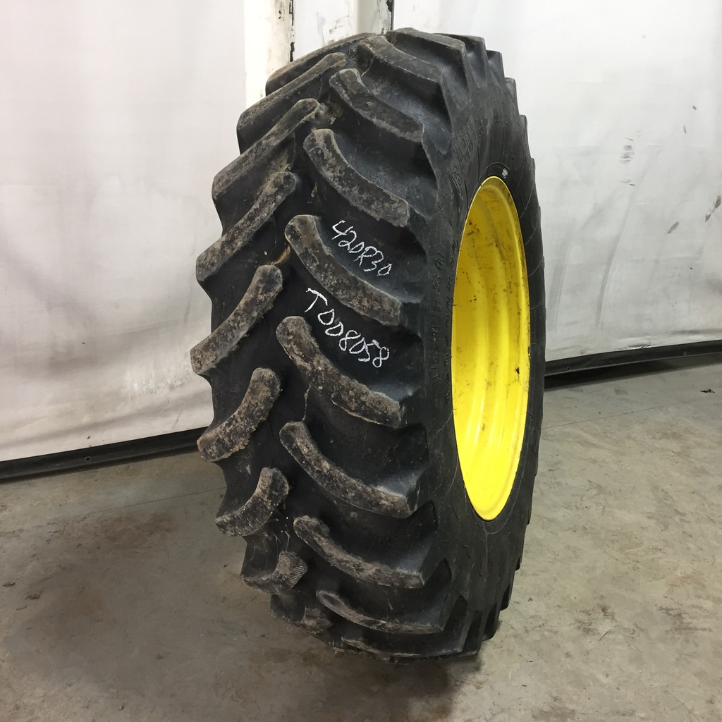 420/90R30 Firestone Radial All Traction FWD R-1 on John Deere Yellow 12-Hole Waffle Wheel (Groups of 3 bolts) 60%
