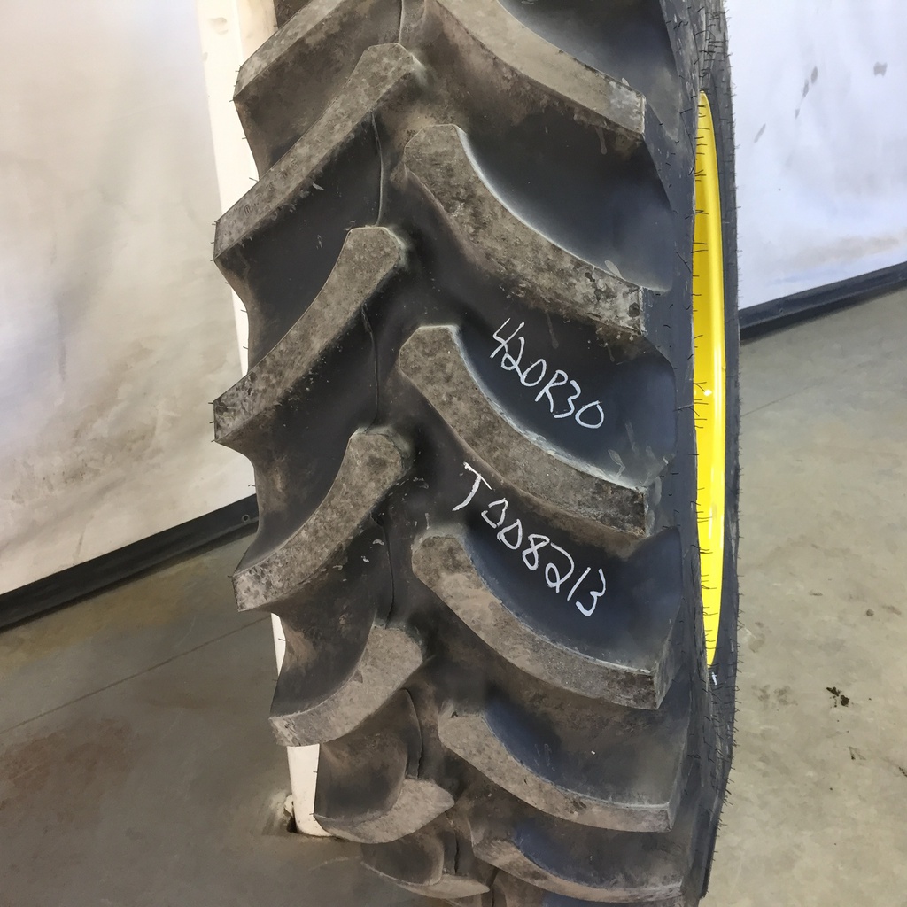420/90R30 Firestone Radial All Traction FWD R-1 on John Deere Yellow 12-Hole Waffle Wheel (Groups of 3 bolts) 95%