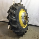 18.4/-38 Firestone Champion Spade Grip R-2 on John Deere Yellow 10-Hole Dolly Dual 80%
